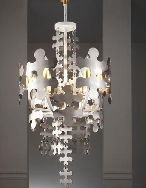 Tall hand-crafted chrome pendant light with jigsaw design from Italy