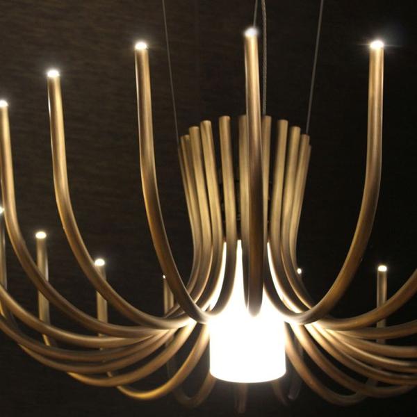 Understated small modern chandelier in bronze or black metal