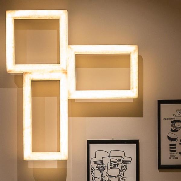 Quirky and unique triple picture frame style light in a neutral marble colour