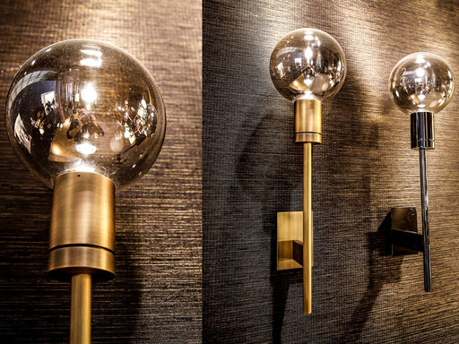 Bronze wall light with exposed bulb and  shiny flecks