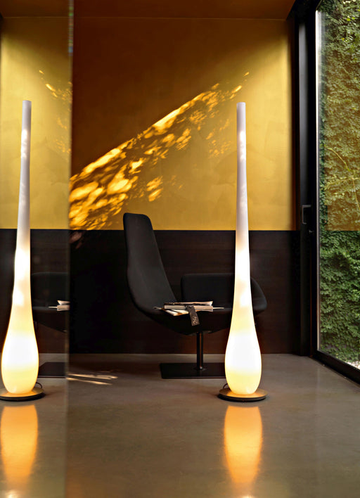 Tall modern white droplet-shaped Murano glass floor lamp on a steel frame