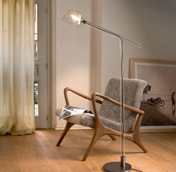 Modern smoked or clear glass floor light with exposed cable