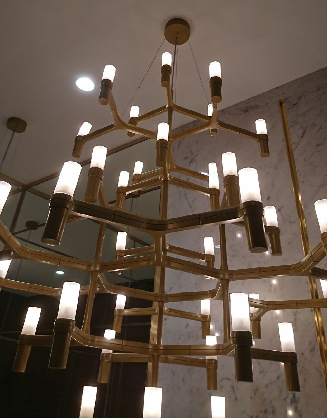 Large bespoke modern ceiling lighting installation for a top London hotel