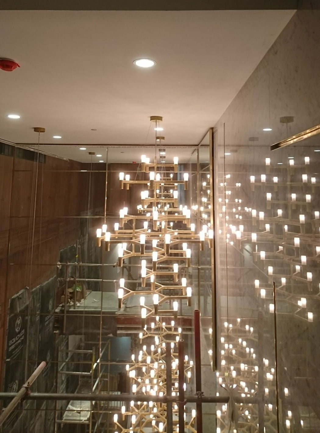 Large bespoke modern ceiling lighting installation for a top London hotel